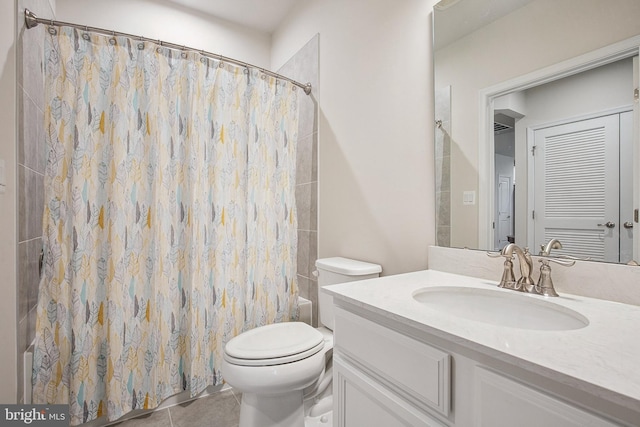 full bathroom with shower / bath combo with shower curtain, toilet, vanity, and tile patterned flooring