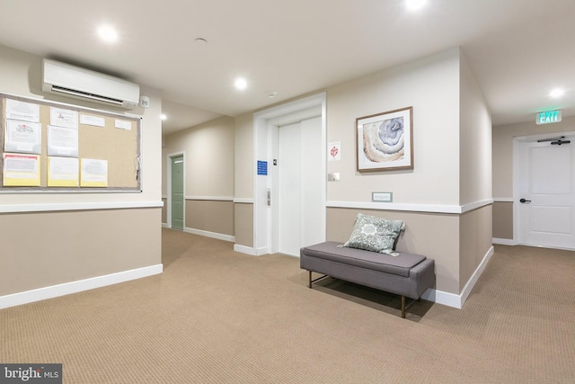 hallway with light colored carpet and a wall mounted air conditioner