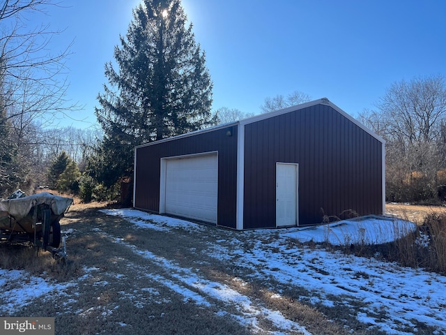 view of snow covered garage