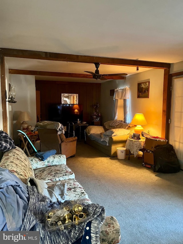 carpeted living room featuring beam ceiling and ceiling fan