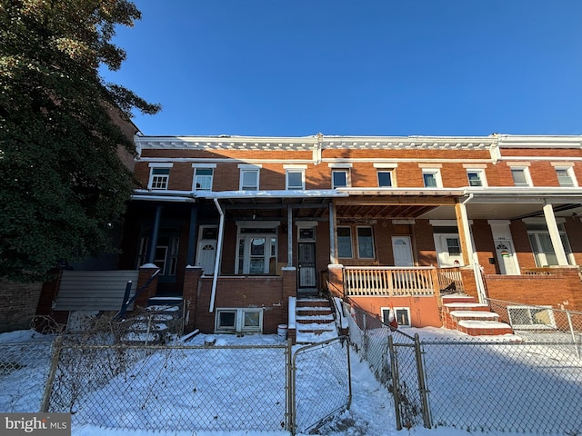 townhome / multi-family property featuring a porch