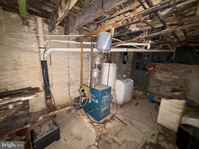 utility room featuring gas water heater