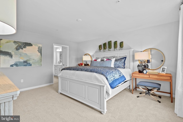 carpeted bedroom with connected bathroom