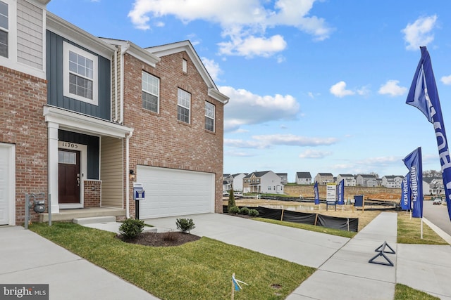 view of side of property with a lawn and a garage