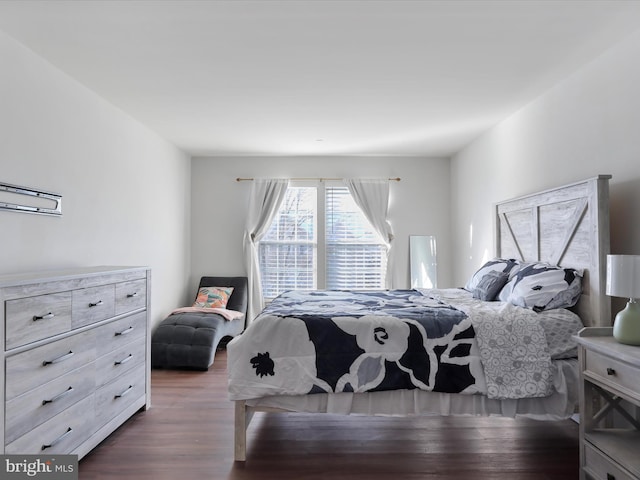 bedroom featuring dark hardwood / wood-style flooring