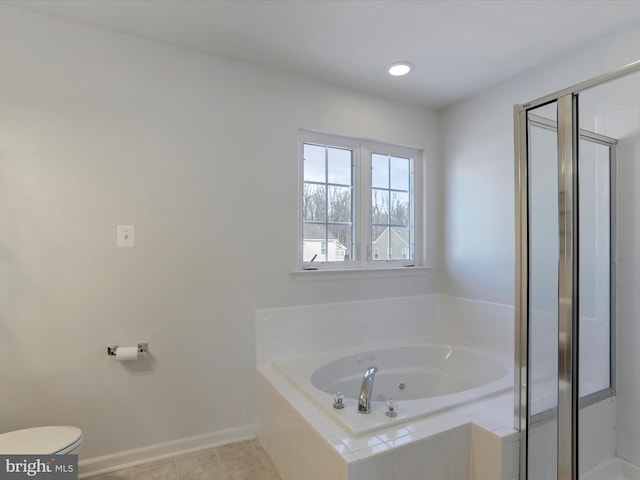 bathroom with tile patterned floors, toilet, and independent shower and bath