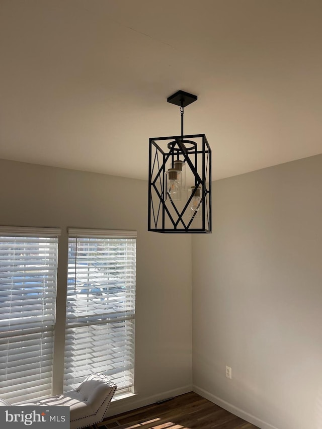 unfurnished dining area with dark hardwood / wood-style flooring