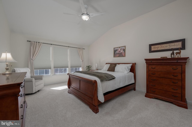 bedroom featuring ceiling fan, light colored carpet, and lofted ceiling