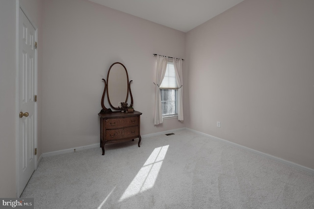 bedroom with light colored carpet