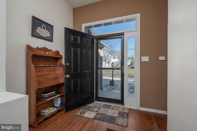 foyer with dark hardwood / wood-style flooring