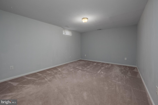 unfurnished room with carpet flooring