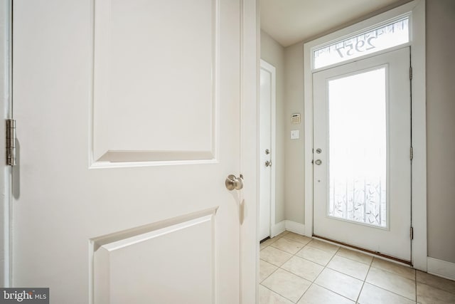 doorway featuring light tile patterned floors