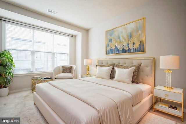 bedroom featuring light colored carpet