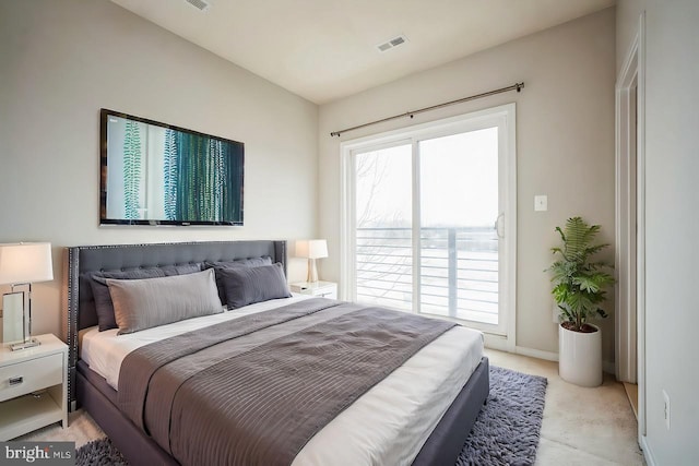 bedroom featuring light carpet