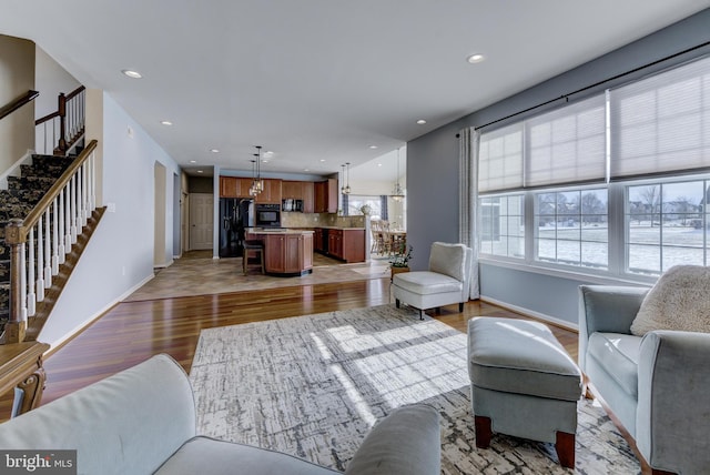 living room with light hardwood / wood-style flooring