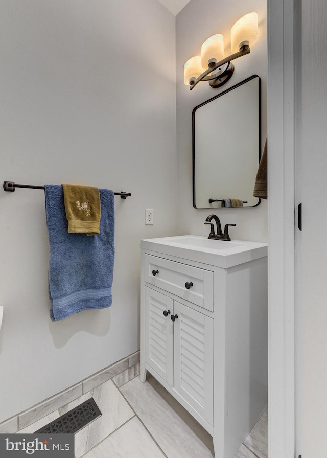 bathroom with vanity and tile patterned flooring