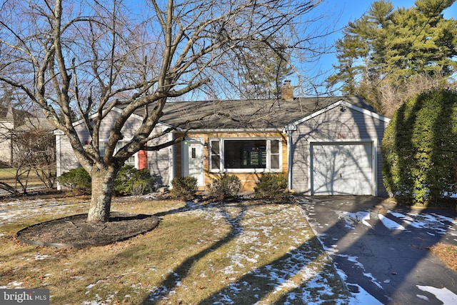 single story home featuring a garage