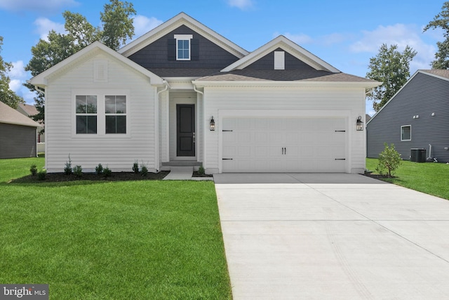 view of front of home featuring a garage, central AC, and a front yard