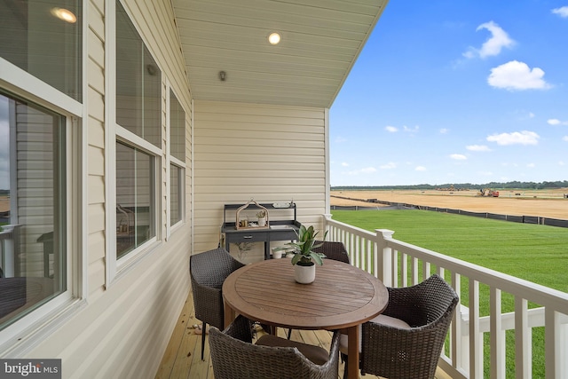 balcony featuring a rural view