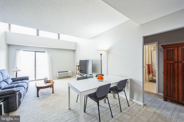 carpeted dining space featuring a textured ceiling and an AC wall unit