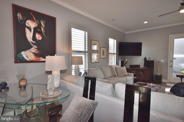 living room with ceiling fan, crown molding, and hardwood / wood-style floors