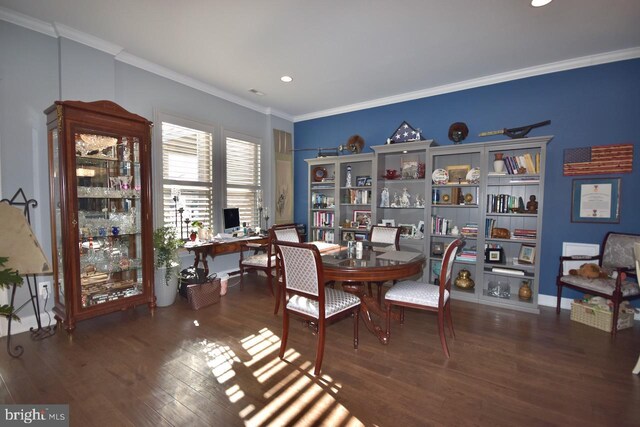 dining space with dark hardwood / wood-style floors and ornamental molding