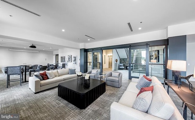 living room featuring a barn door