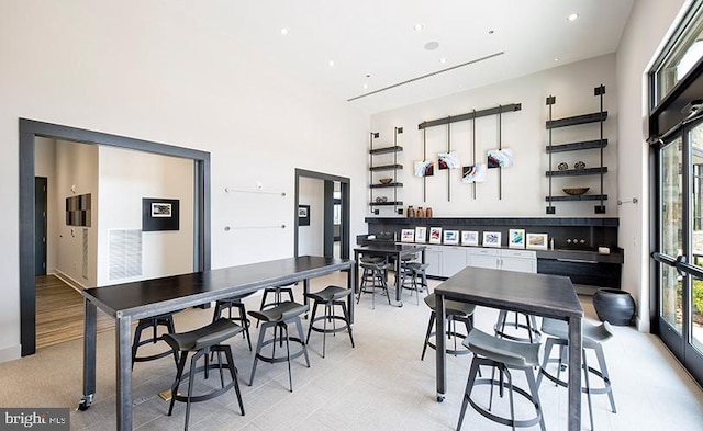 dining space with a high ceiling