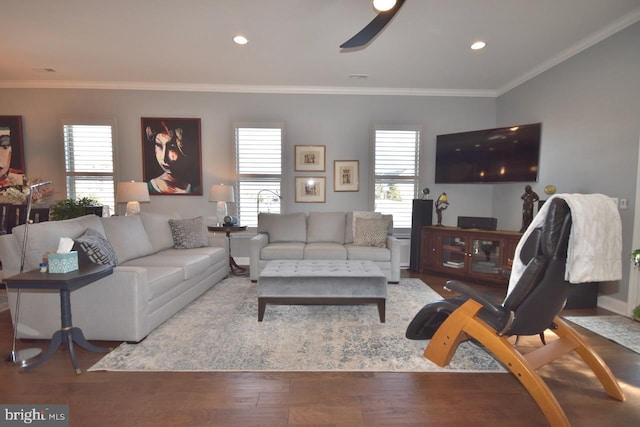 living room with light hardwood / wood-style floors, plenty of natural light, and crown molding