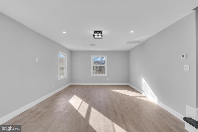 spare room featuring light hardwood / wood-style flooring