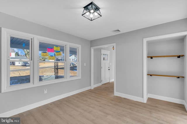 interior space featuring a closet and light hardwood / wood-style flooring