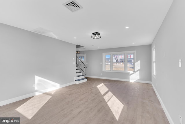 unfurnished living room featuring light wood-type flooring