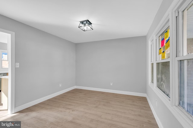 unfurnished room featuring light hardwood / wood-style floors