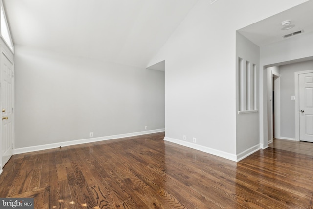 interior space with lofted ceiling and dark hardwood / wood-style floors