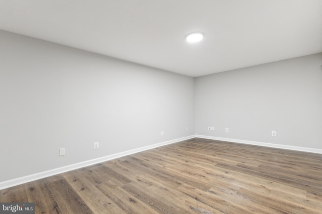 empty room featuring wood-type flooring