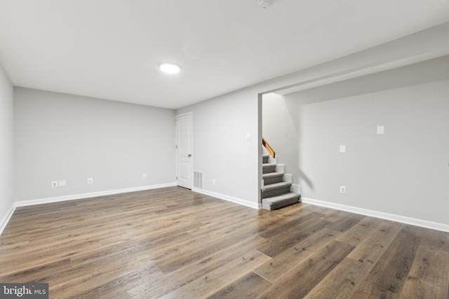 basement featuring dark hardwood / wood-style flooring