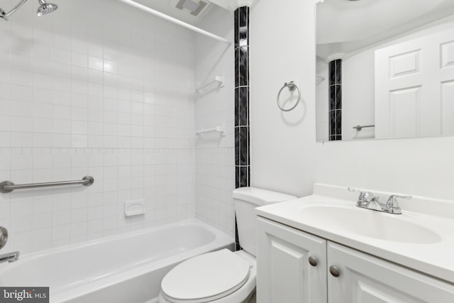 full bathroom featuring toilet, tiled shower / bath combo, and vanity