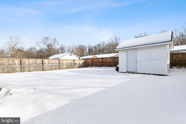 view of yard layered in snow