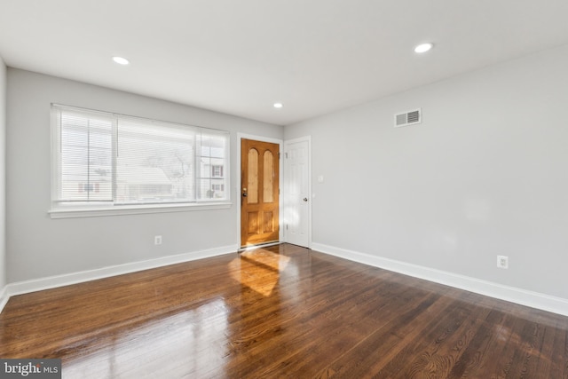 empty room with dark wood-type flooring