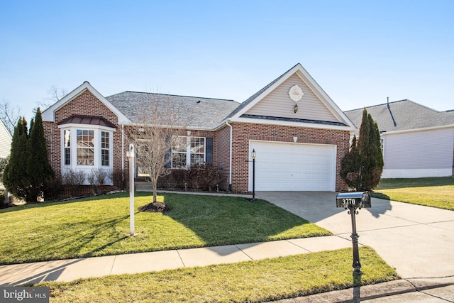 view of front of house featuring a garage and a front yard