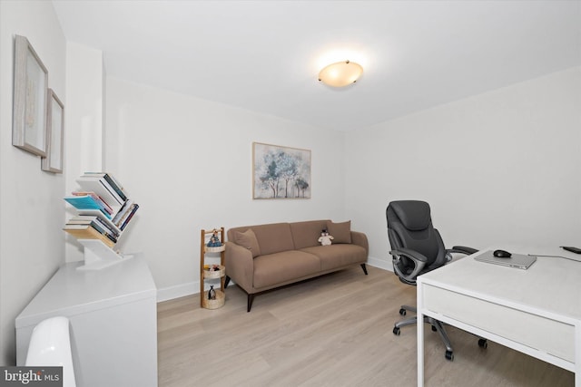 office space with light hardwood / wood-style floors