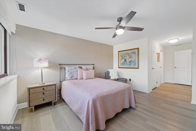 bedroom featuring ceiling fan and light hardwood / wood-style floors