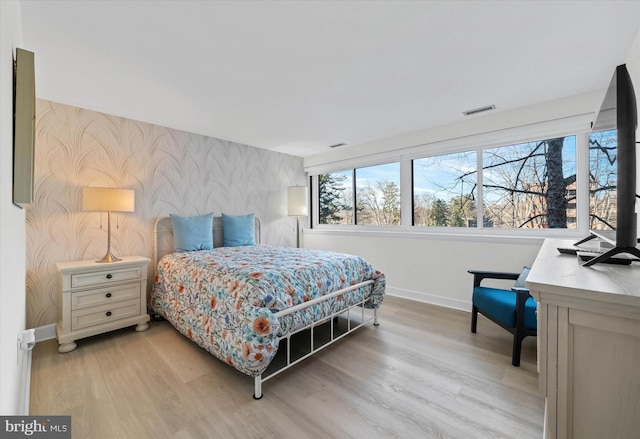 bedroom with light hardwood / wood-style flooring