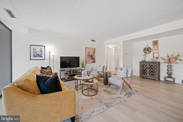 living room with light hardwood / wood-style floors