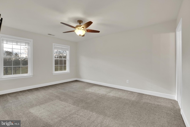 unfurnished room featuring carpet flooring and ceiling fan