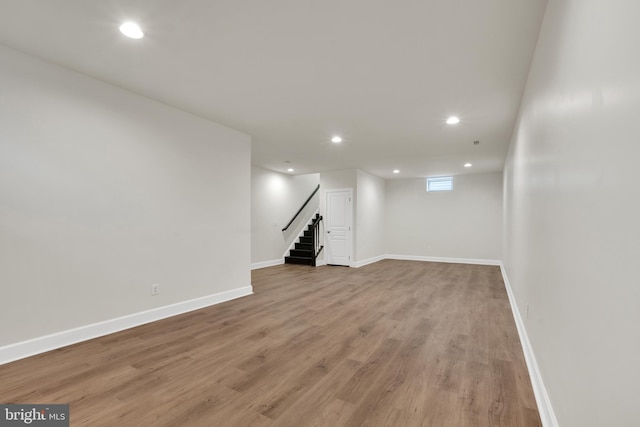 basement featuring hardwood / wood-style flooring