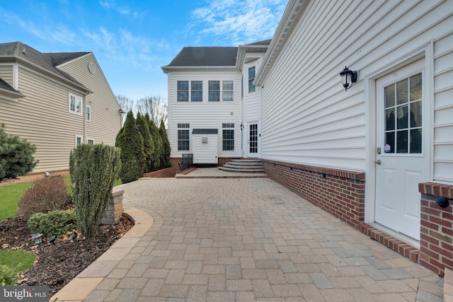 rear view of house featuring a patio