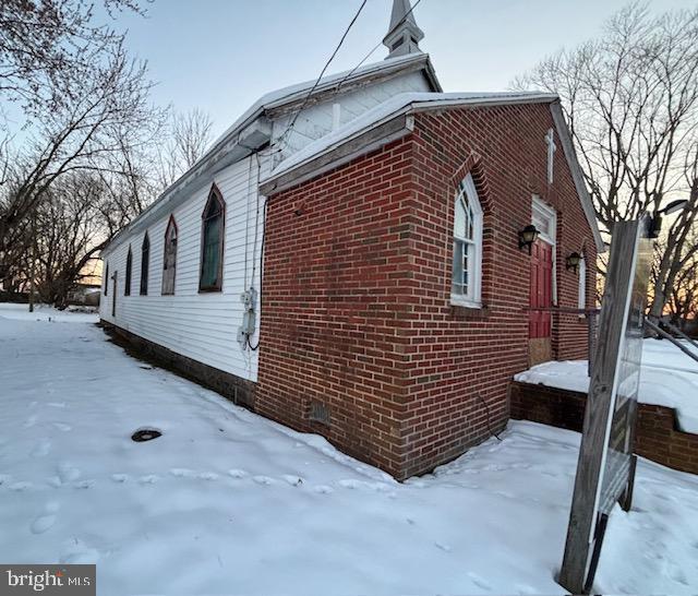 view of snow covered property