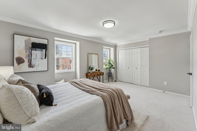 bedroom with light colored carpet, a closet, and crown molding