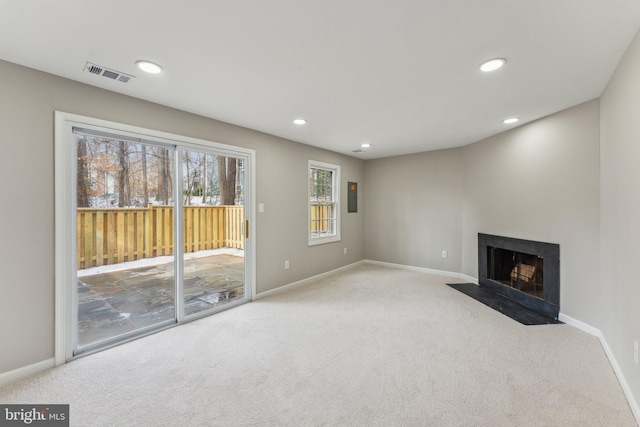 unfurnished living room with light carpet